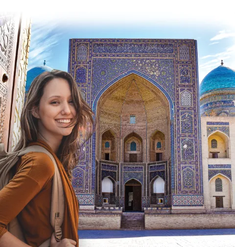 A woman in front of Mir-i-Arab Madrasa, Uzbekistan